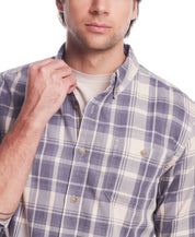 Model wearing long sleeve burnout flannel in natural plaid pattern, showcasing button-down collar and patch pocket.