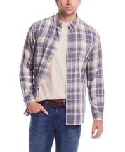 Man wearing a long sleeve burnout flannel shirt in natural plaid, featuring a button-down collar and chest pocket.