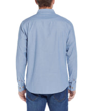Long Sleeve Chambray Shirt In Chambray Blue back view, featuring a button down collar and cuffed sleeves.