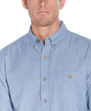 Long Sleeve Chambray Shirt In Chambray Blue displayed on a male model, featuring button down collar and chest pocket.