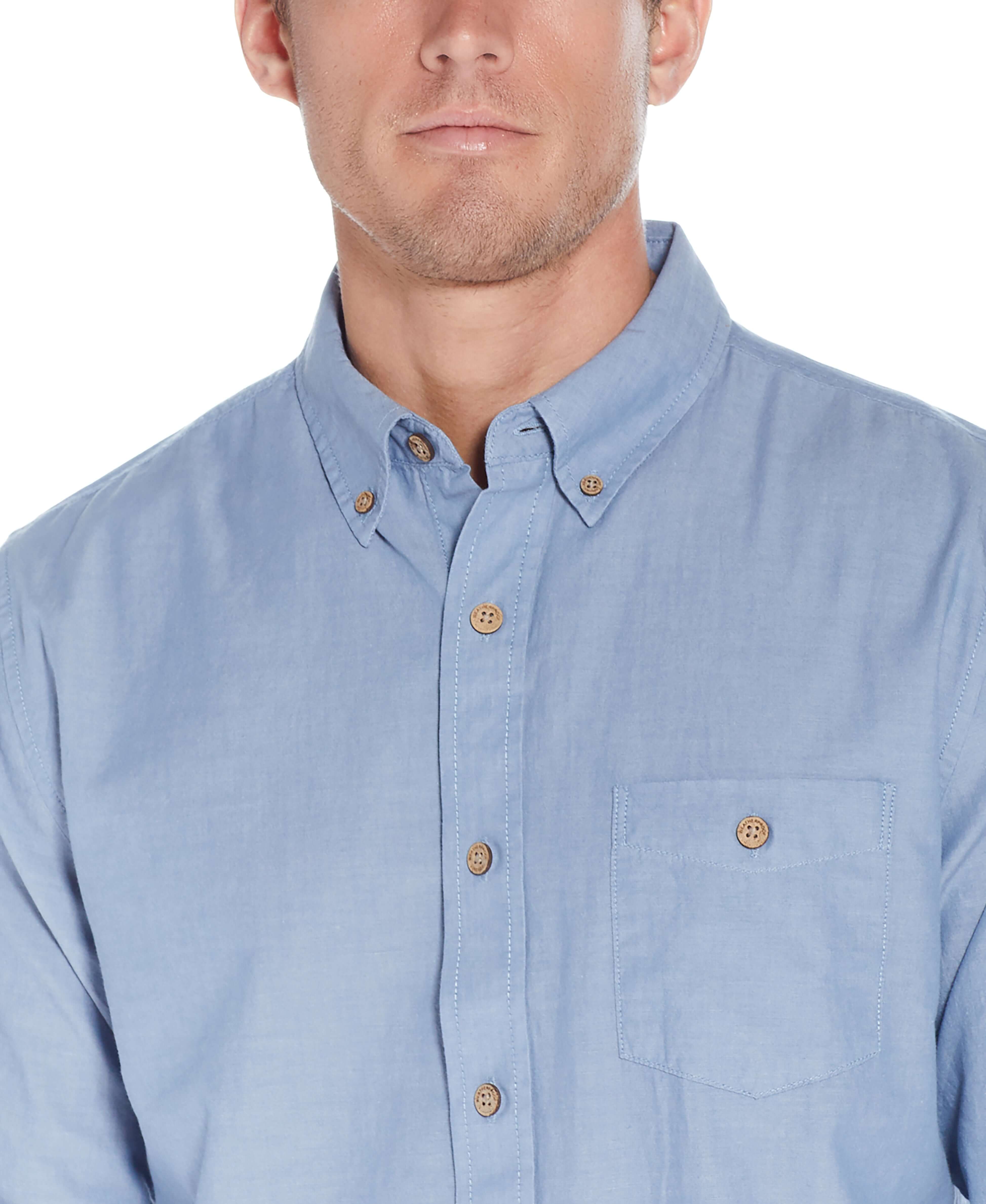 Long Sleeve Chambray Shirt In Chambray Blue displayed on a male model, featuring button down collar and chest pocket.