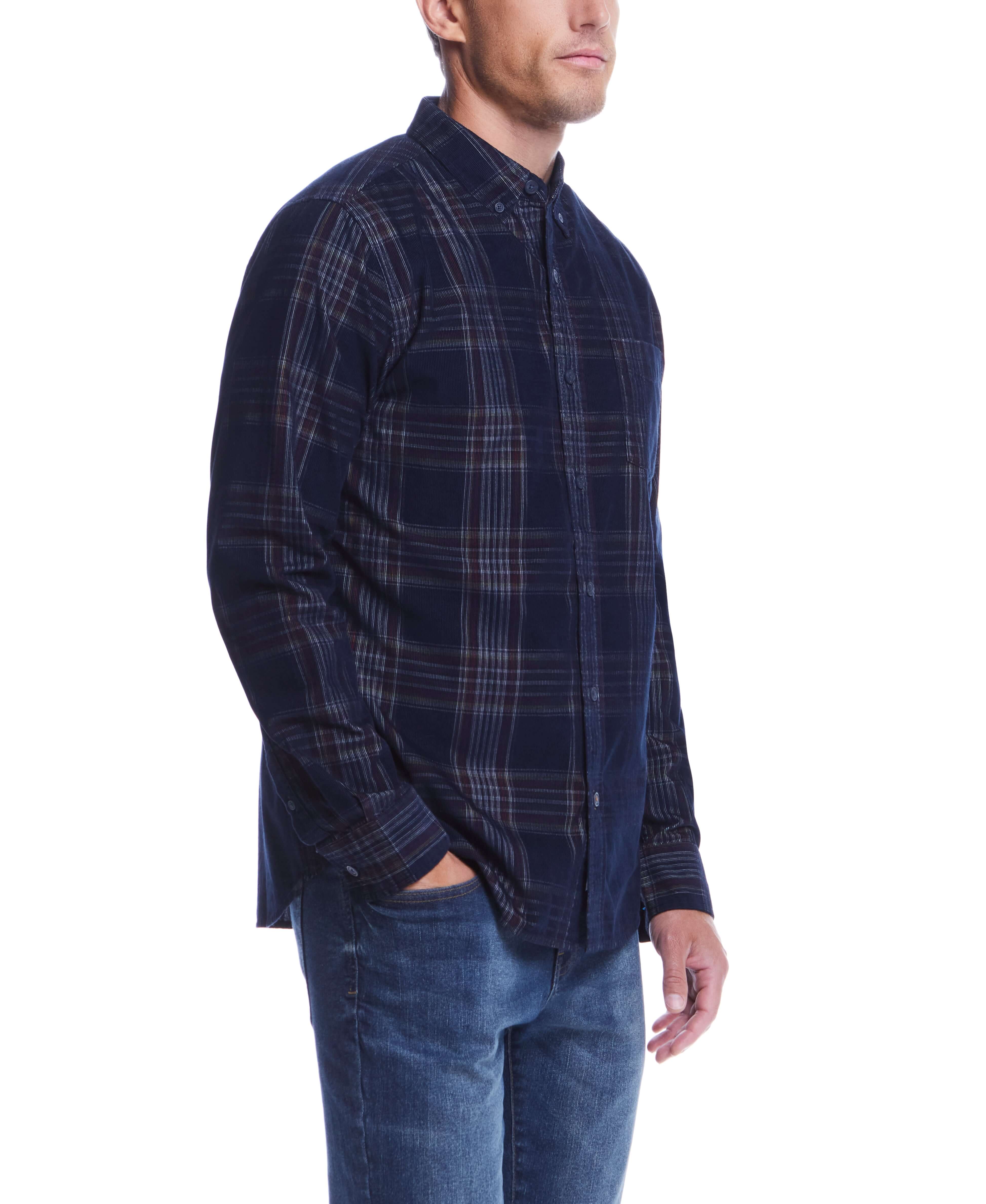 Side view of a man in a Long Sleeve Plaid Cord Shirt in blue, styled with denim for a cozy yet polished look.
