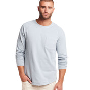 Long sleeve raglan sweatshirt in dusty blue with chest pocket, ideal for vintage-inspired comfort.