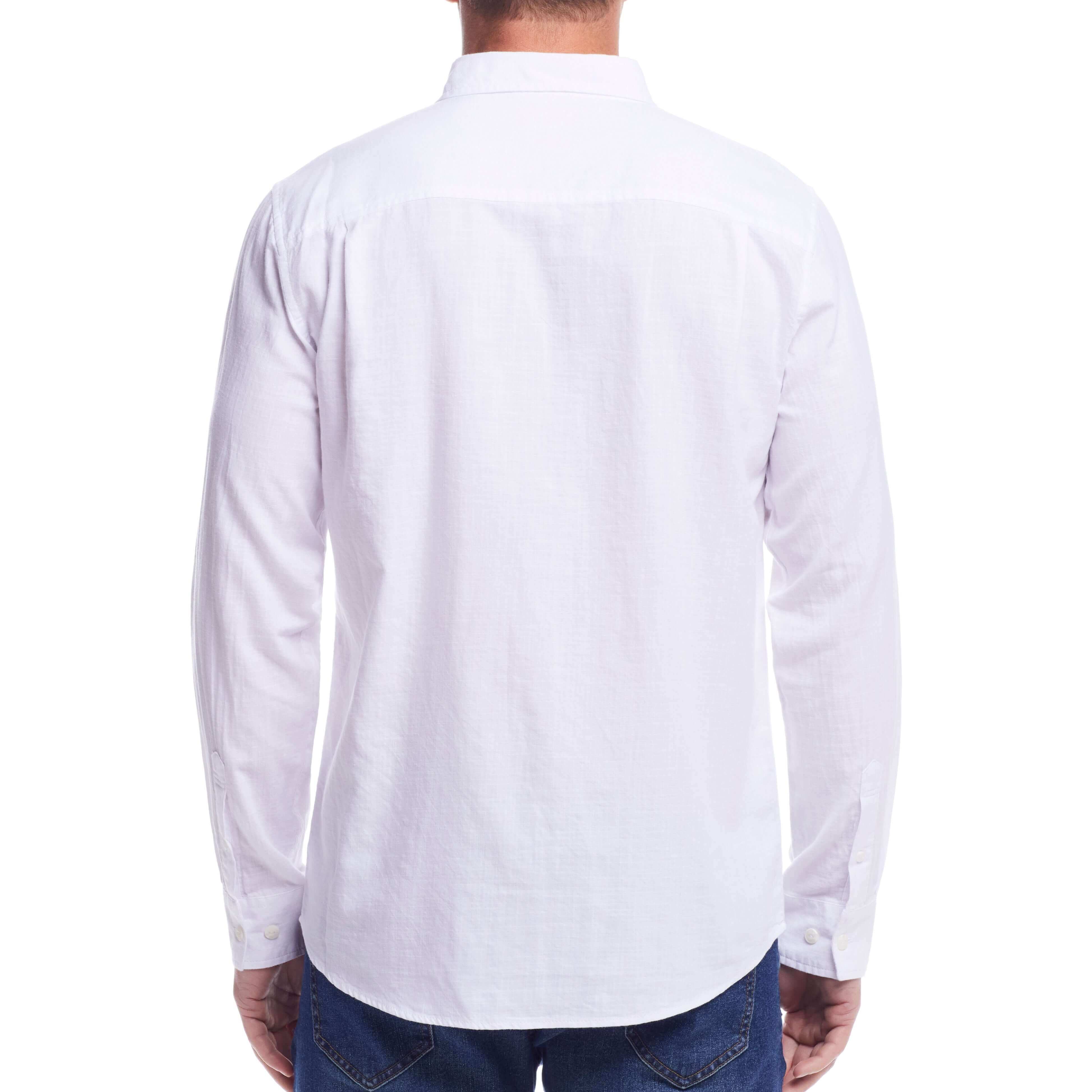 Back view of a man wearing a long sleeve solid cotton twill shirt in white, showcasing its classic design and comfort.