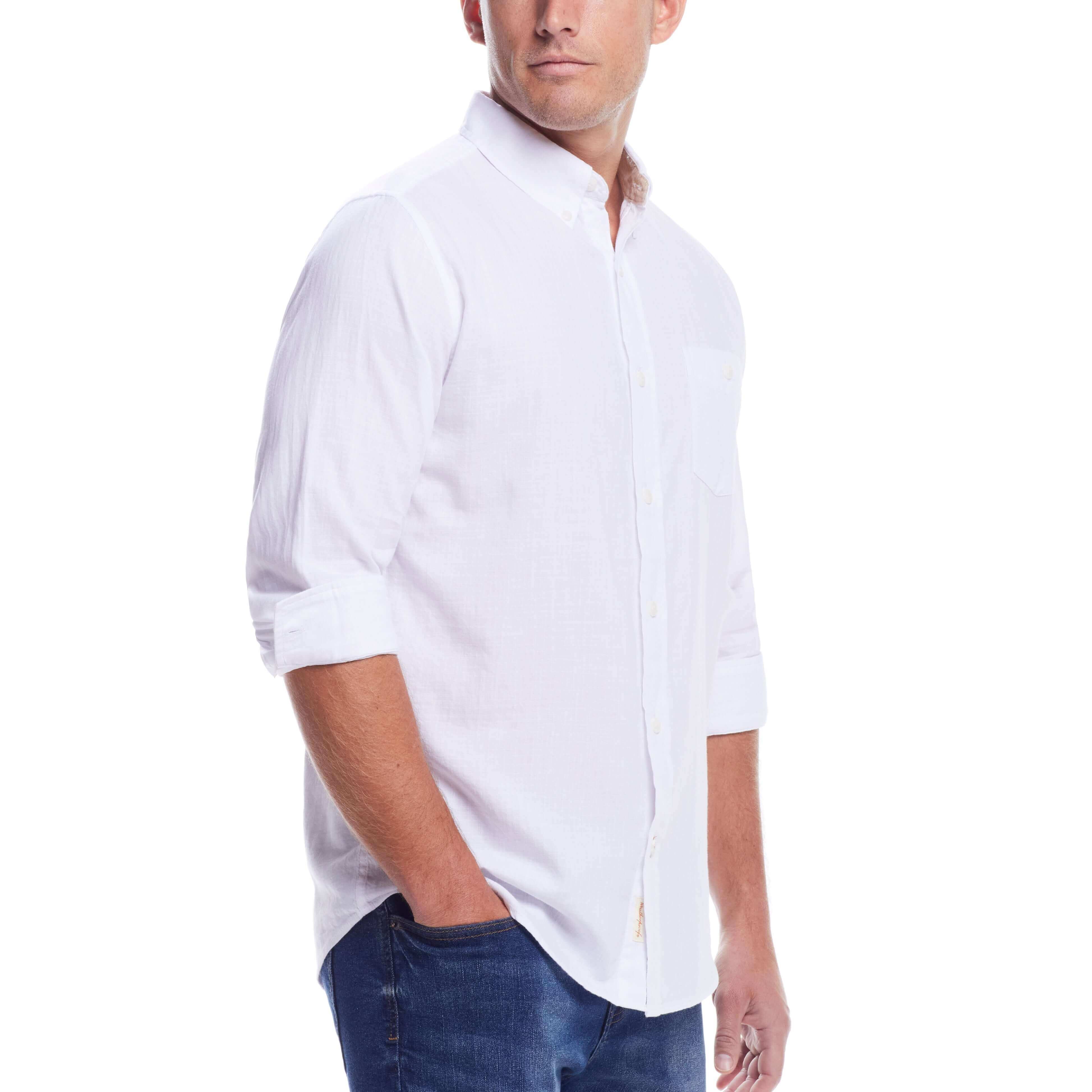 Model wearing a long sleeve solid cotton twill shirt in white, showcasing a classic button-down collar and chest pocket.