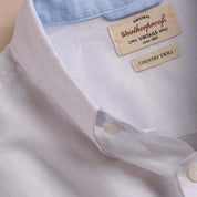 Close-up of a white cotton twill shirt showcasing the collar and labels, highlighting vintage Weatherproof quality.