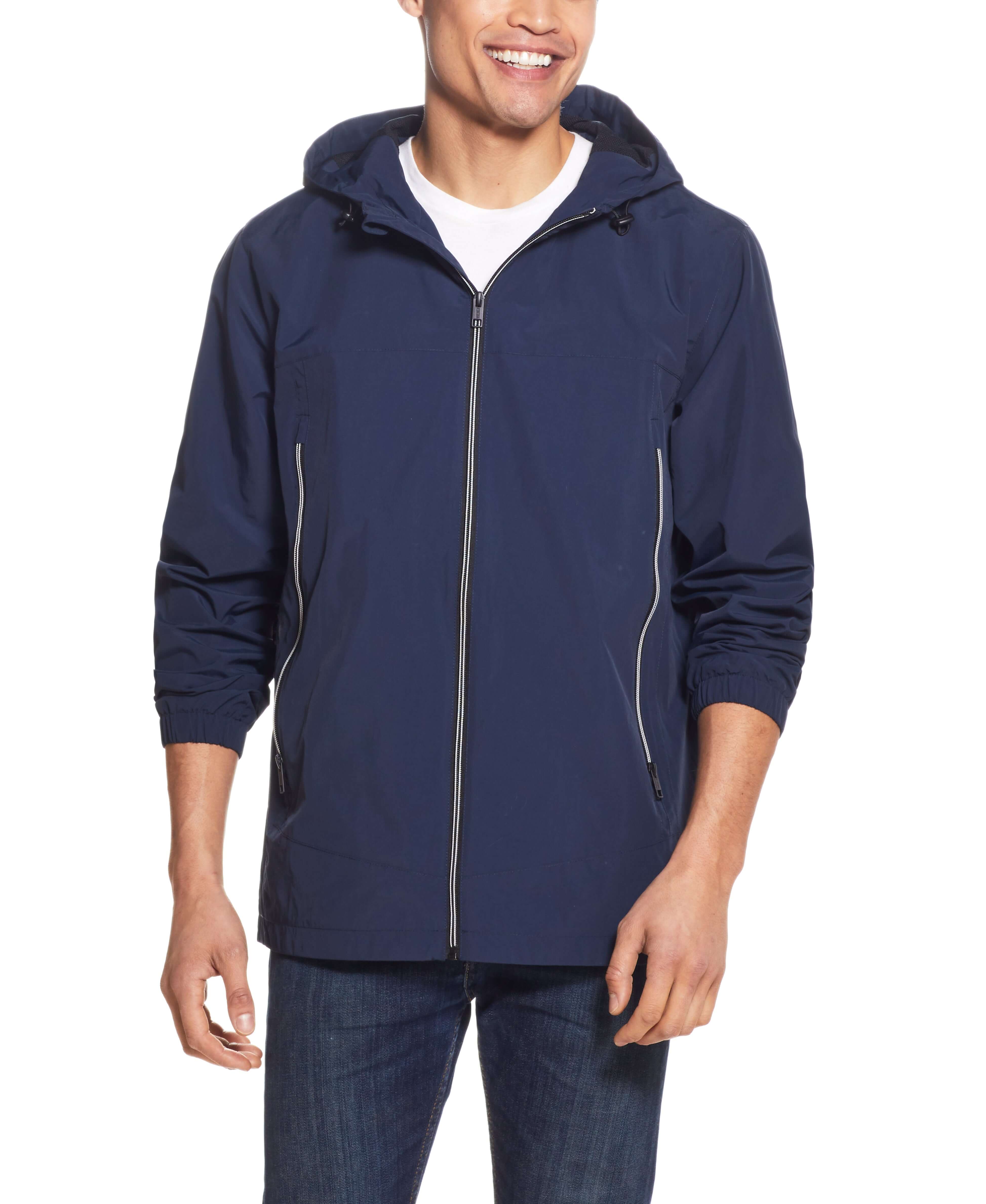 Nylon Zip Front Jacket In Navy worn by a man, showcasing its water and wind resistant features.