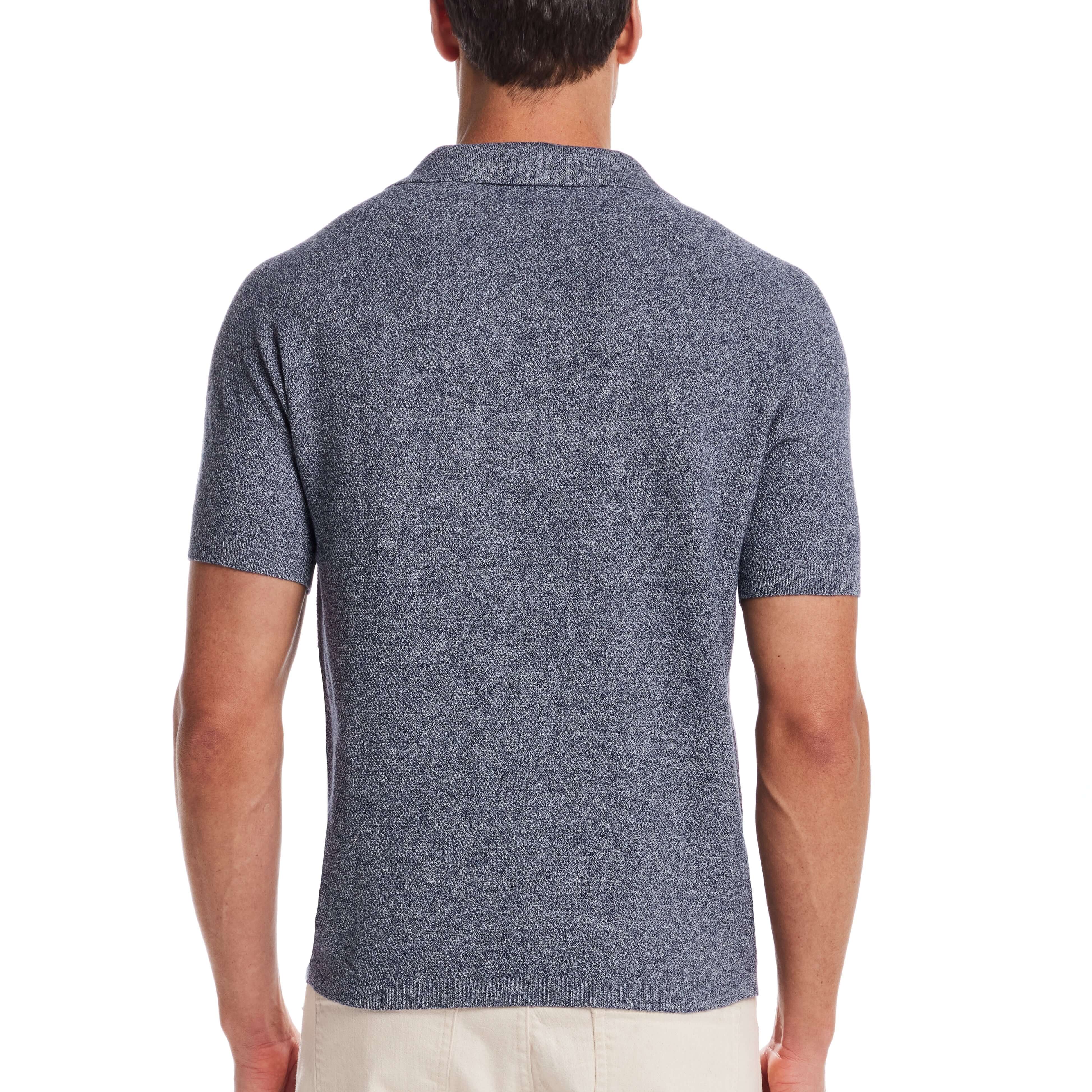 Back view of a man wearing an open collar polo sweater in sailor twist, showcasing its comfortable knit fabric.