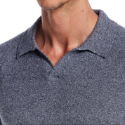 Close-up of a man wearing an Open Collar Polo Sweater in Sailor Twist, showcasing the collared neckline and textured fabric.