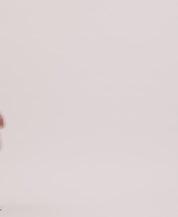 Model showcasing the Open Collar Polo Sweater in Sailor Twist, featuring a stylish collared neckline and lightweight design.