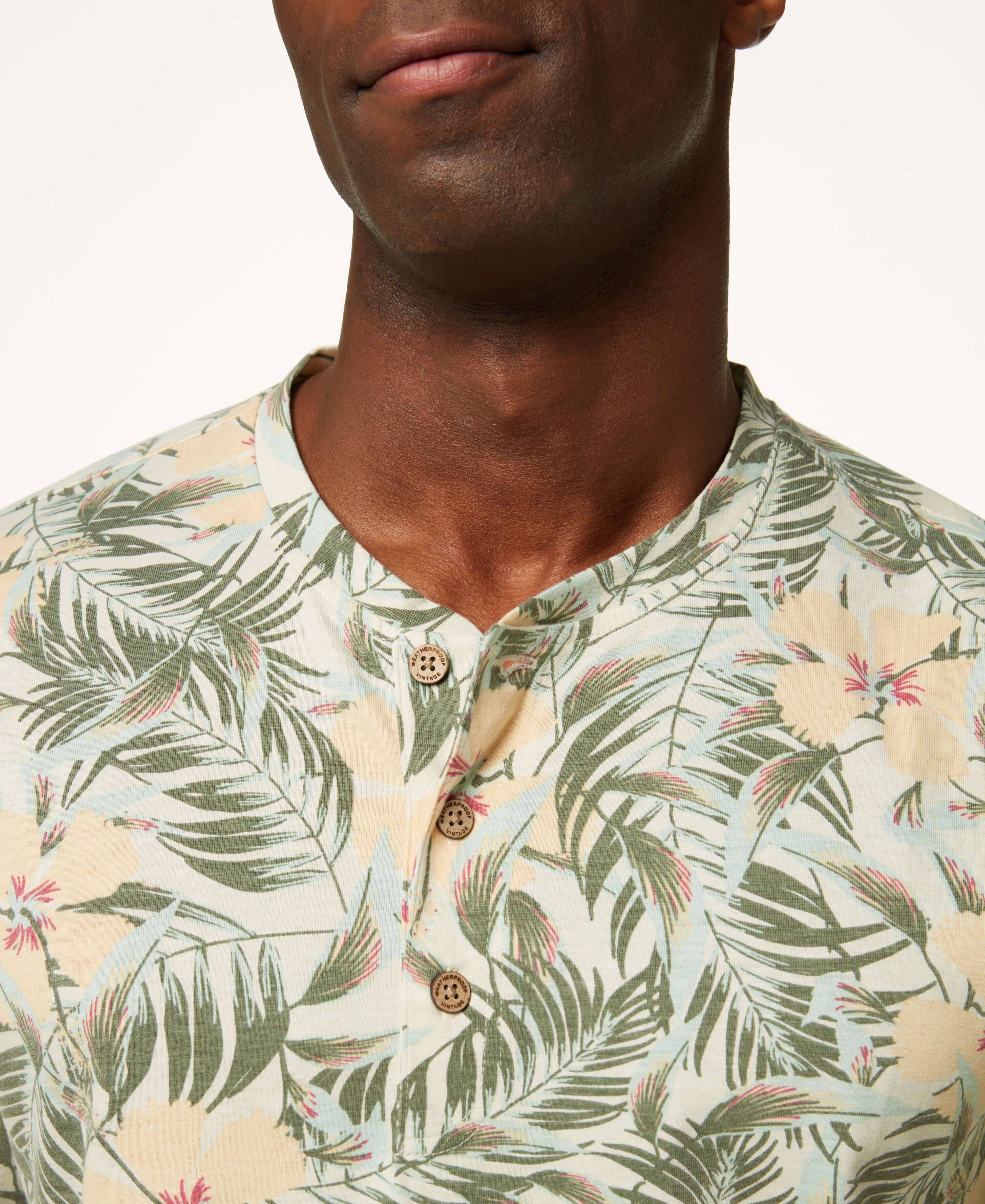 Printed Short Sleeve Henley In Antique White with tropical leaf pattern and three button placket.