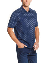 Short Sleeve Allover Print Jersey Polo In Dress Blues worn by a man, featuring a compass mini print and a classic polo collar.