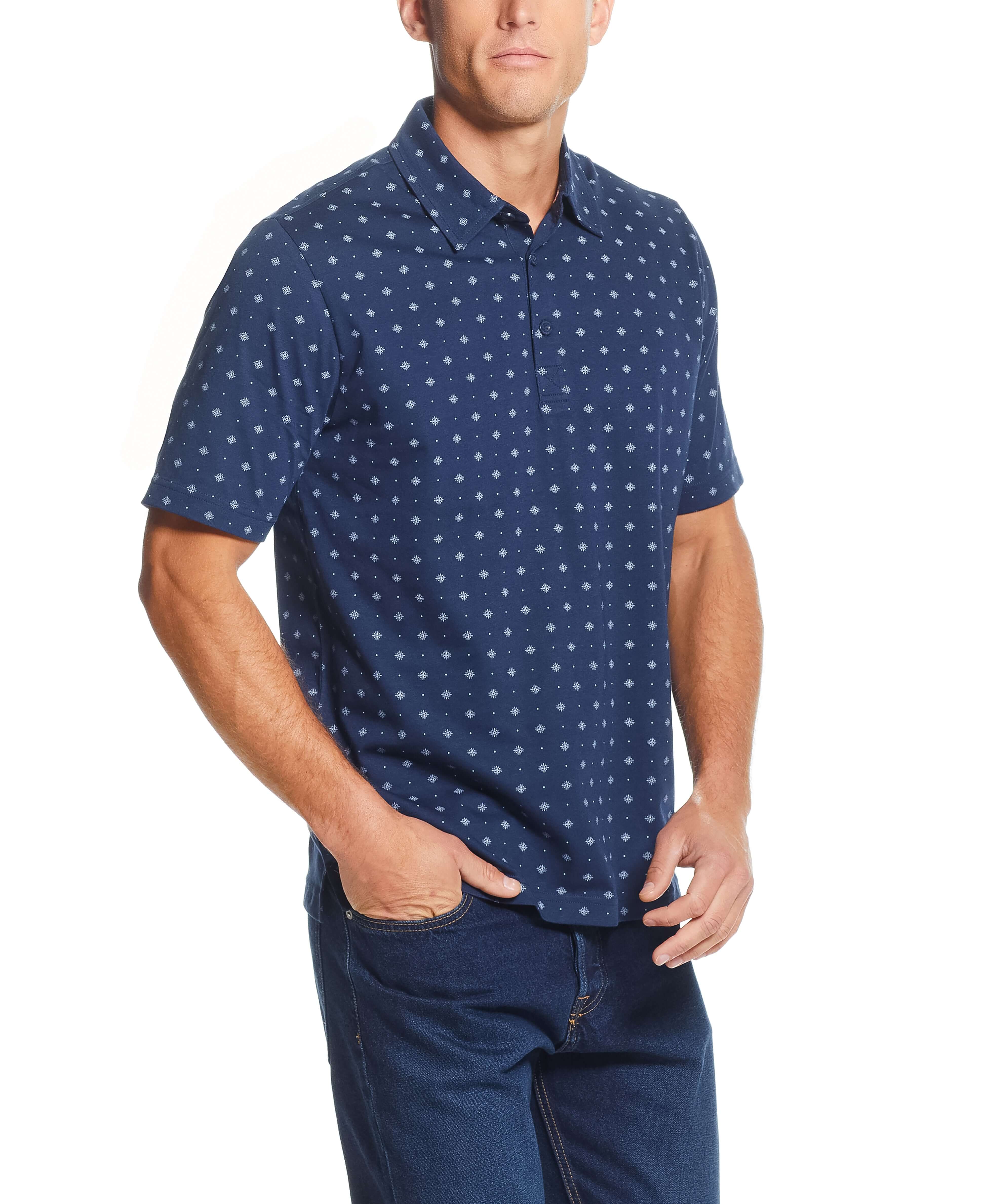 Short Sleeve Allover Print Jersey Polo In Dress Blues worn by a man, featuring a compass mini print and a classic polo collar.