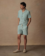 Model wearing Short Sleeve Corduroy Cabana Shirt and matching shorts in Teal Mist, perfect for beach vacations.