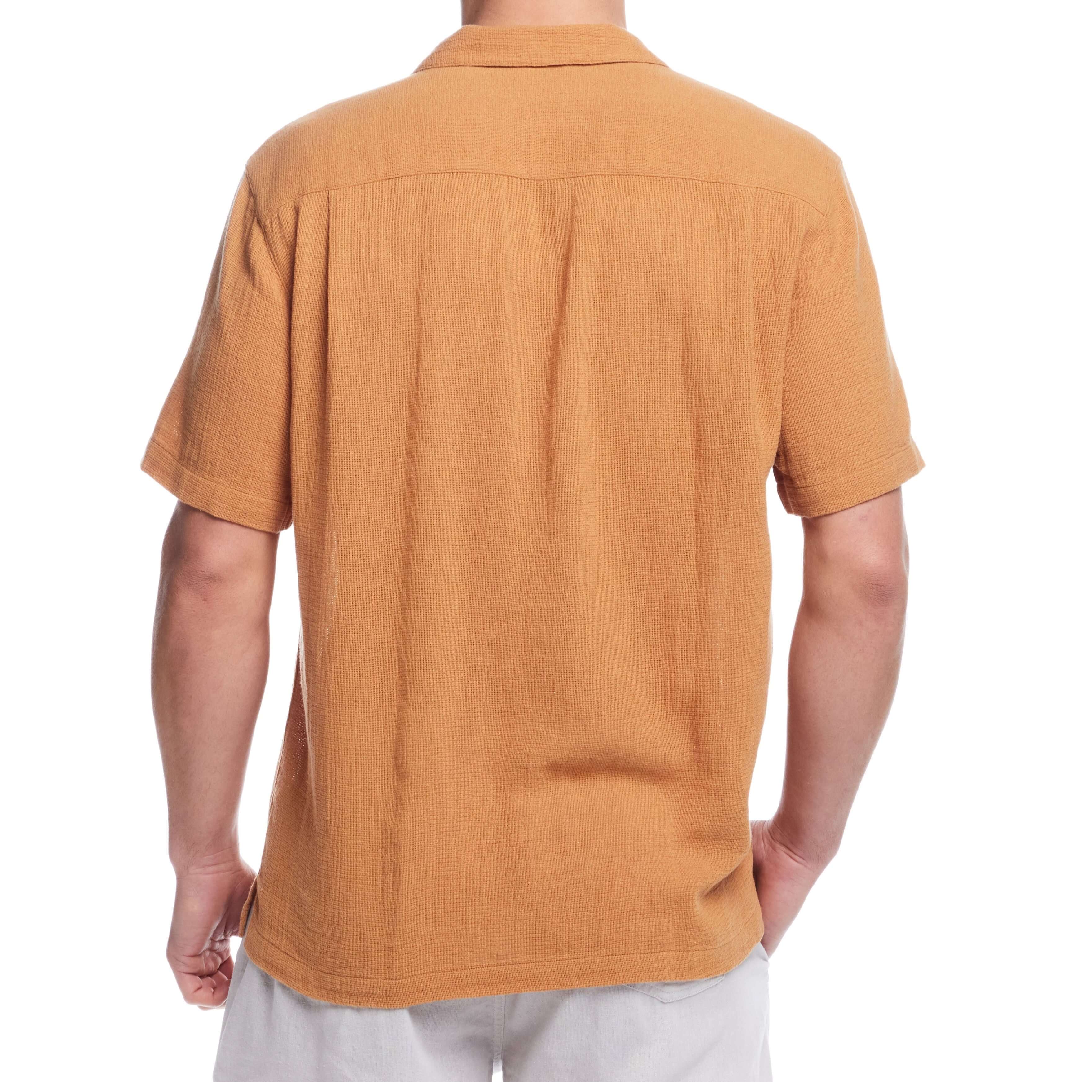 Back view of a man's short sleeve cotton linen Airtex shirt in biscuit color, showcasing classic vacation style and camp collar.