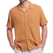 Short sleeve cotton linen Airtex shirt in biscuit color with camp collar and chest pocket, ideal for vacations.
