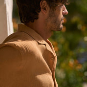 Short sleeve cotton linen Airtex shirt in Biscuit color, showcasing a camp collar and relaxed fit, ideal for vacation styles.