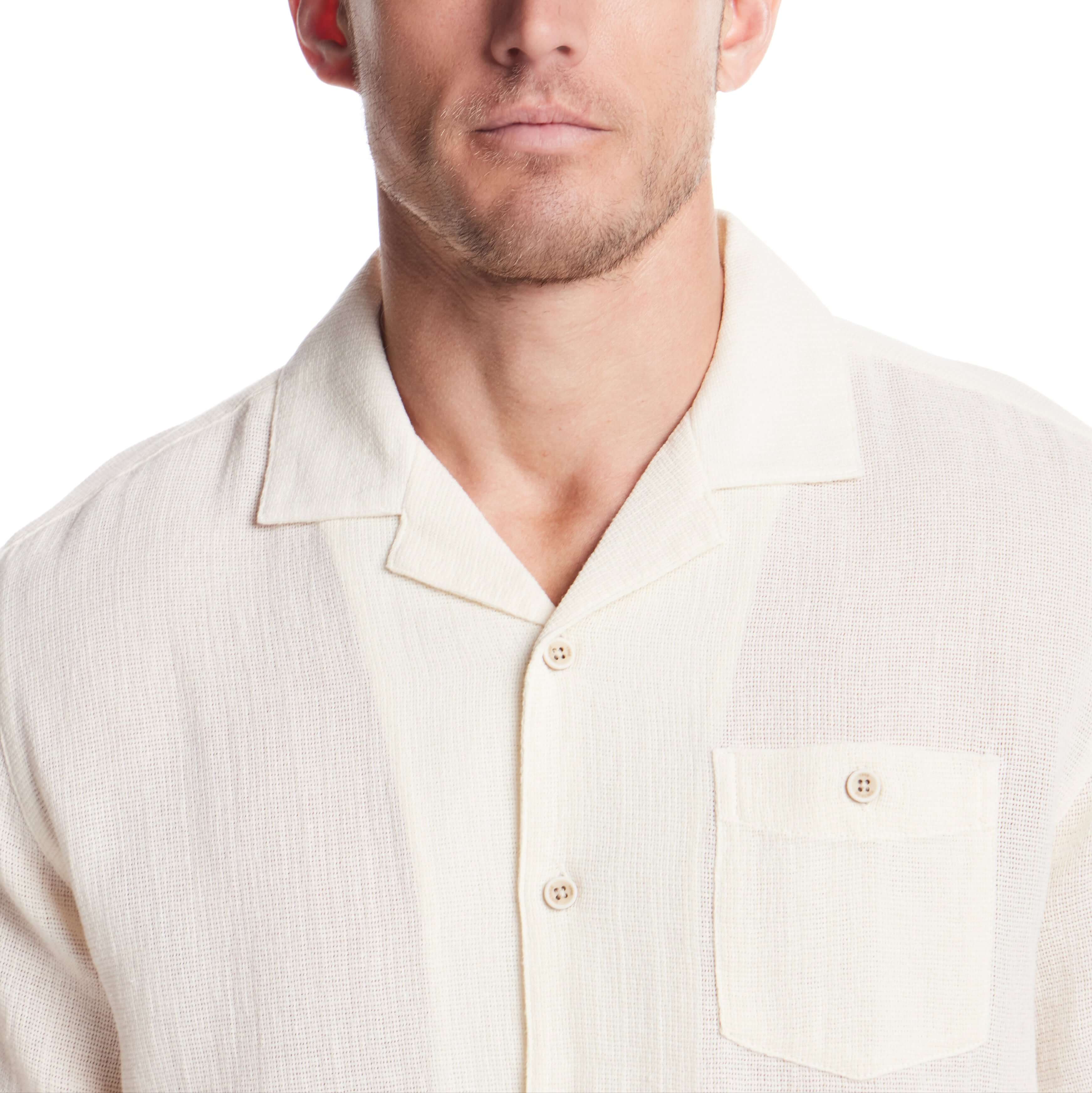 Men's short sleeve cream cotton linen Airtex shirt featuring camp collar and button chest pocket.