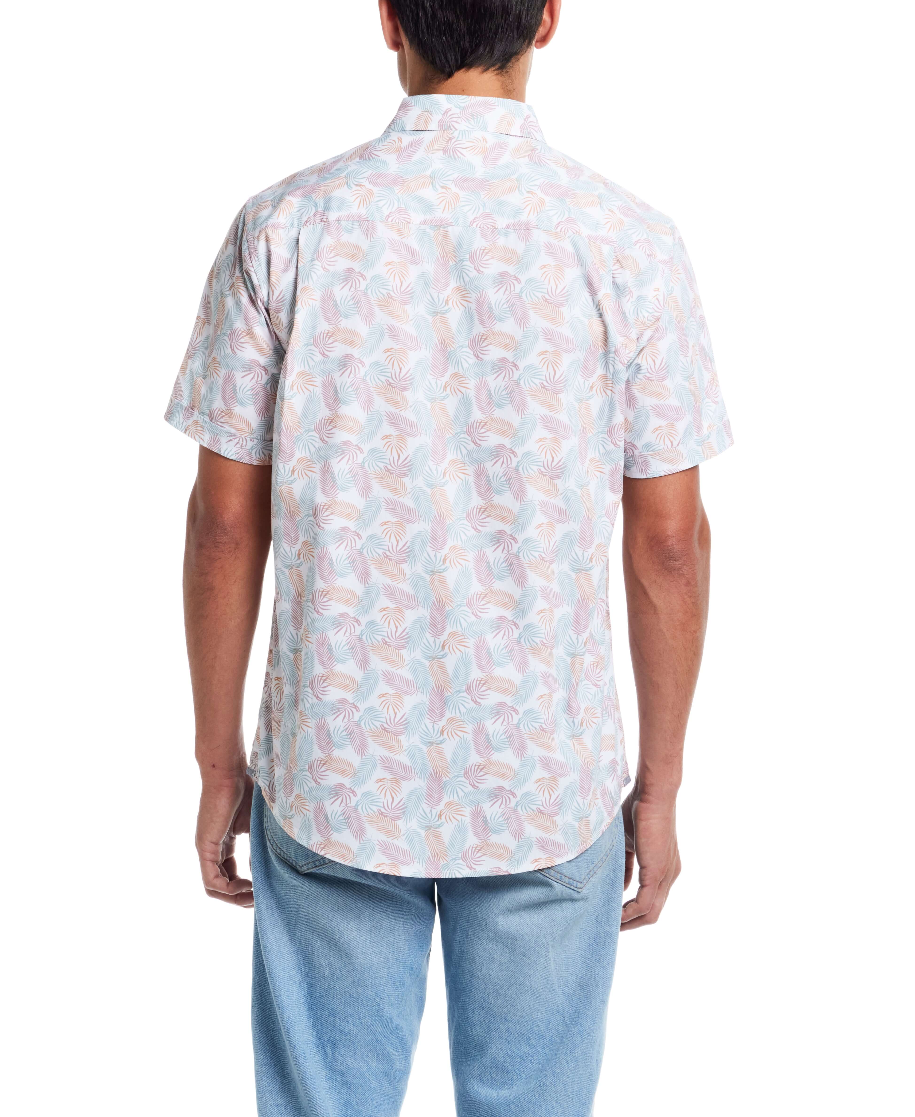 Back view of a man wearing a short sleeve cotton poplin shirt with a lavender leaf pattern.