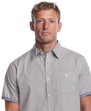 Short sleeve cotton poplin shirt in pecan pie on a male model, showcasing a classic fit and button-down chest pocket.