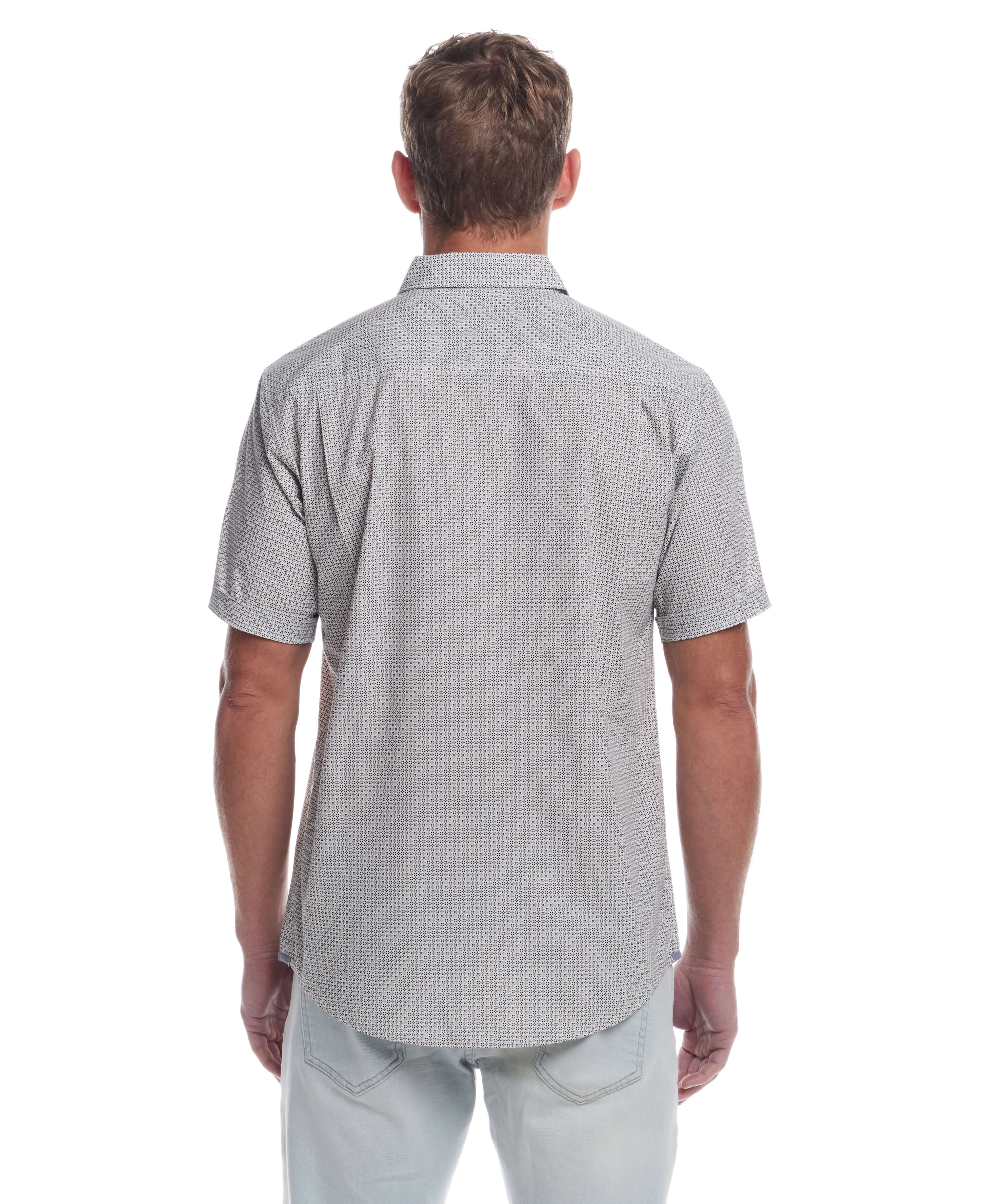 Back view of a man in a short sleeve cotton poplin shirt, showcasing a classic fit and cuffed sleeves.