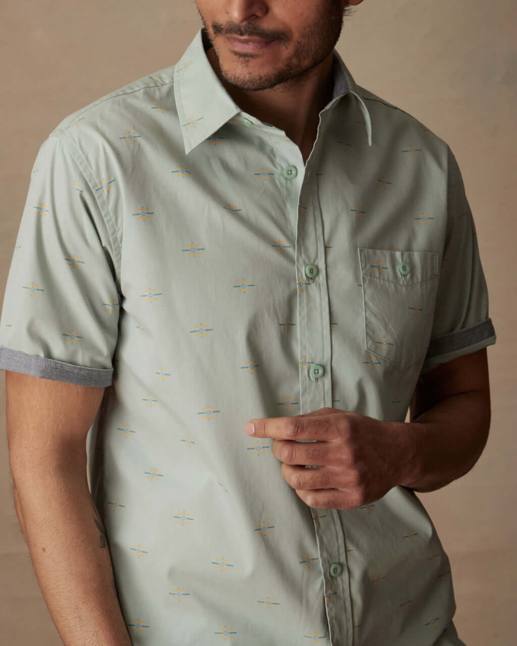Short sleeve cotton poplin shirt in Teal Mist on male model, featuring classic fit, spread collar, and button-down pocket.