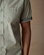 Close-up of a teal mist short sleeve cotton poplin shirt with a button down pocket and cuffed sleeve.