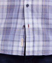 Short Sleeve End-On-End Plaid In Kentucky Blue featuring a button-front detail and relaxed fit.