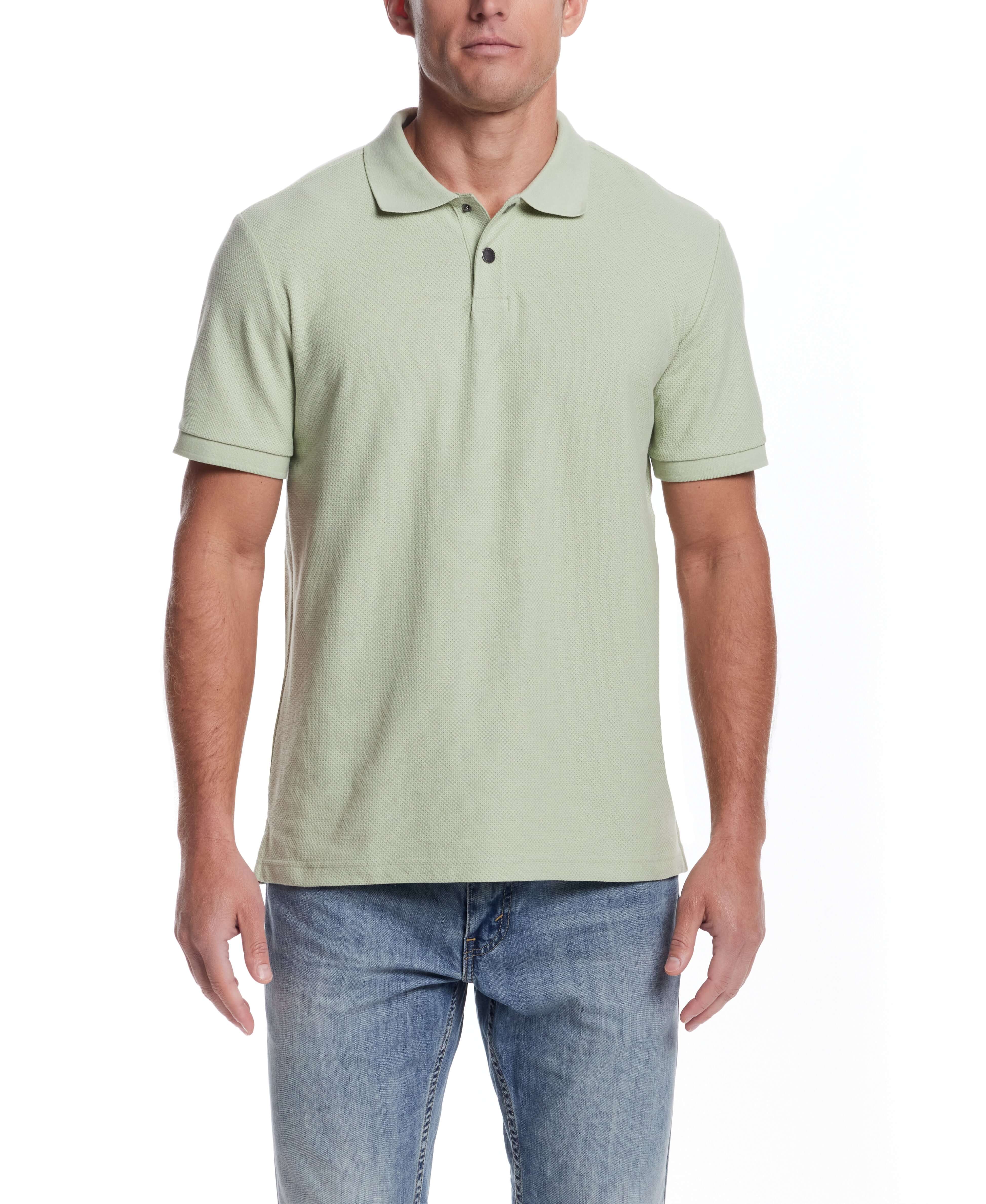 Light green short sleeve honeycomb pique polo shirt on male model, showcasing classic fit and ribbed collar.