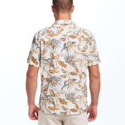 Model wearing a short sleeve linen cotton camp shirt in a bold print with a camp collar and square hem.