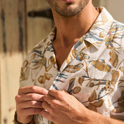 Model wearing Short Sleeve Linen Cotton Camp Shirt in Sugar Almond, featuring a vibrant print and camp collar.
