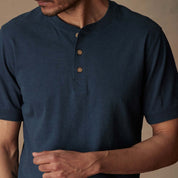 Short sleeve deep cobalt melange henley shirt featuring a three-button placket and rib-knit neck and cuffs.