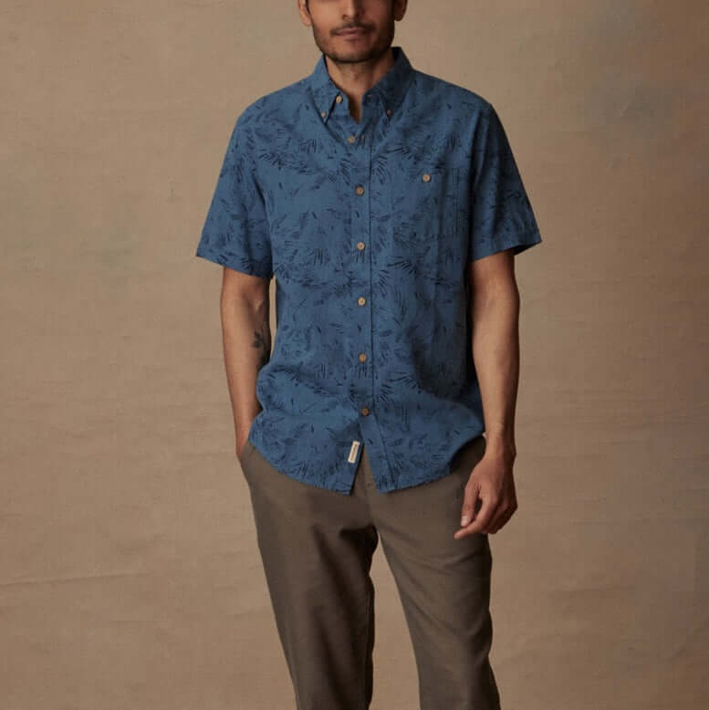 Short sleeve blue ashes linen cotton shirt with abstract print on model for relaxed summer style.