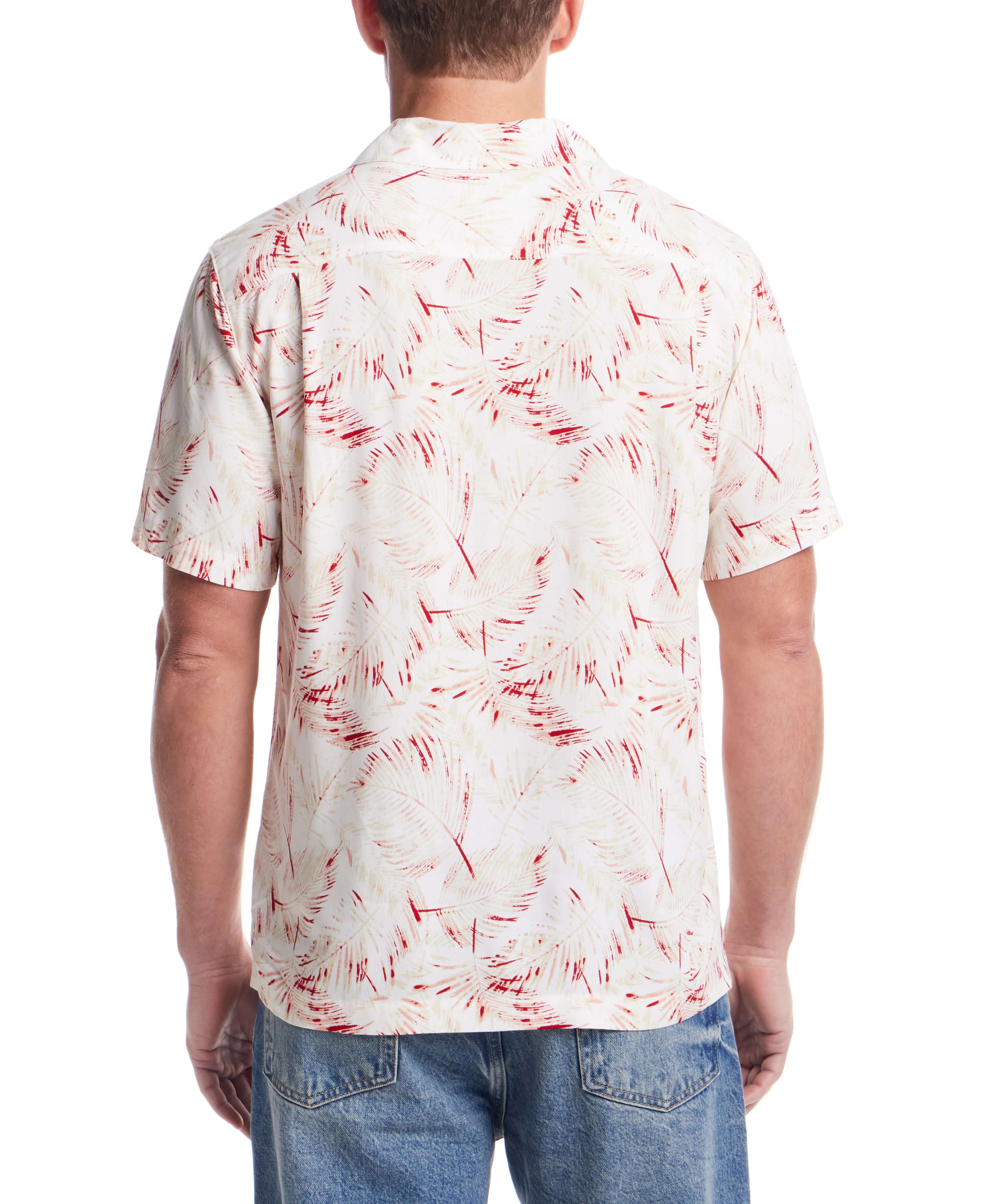 Back view of a short sleeve rayon printed camp shirt in dusty pink with a retro pattern and relaxed fit.