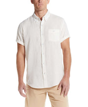 Man wearing a short sleeve solid linen cotton shirt in bright white, ideal for casual and stylish outfits.