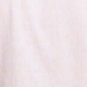 Close-up of soft, solid linen cotton fabric in tangerine hue, ideal for stylish and comfortable shirts.