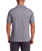 Back view of a man wearing a short sleeve twill polo in Peacoat Navy with a polo collar and chest pocket.