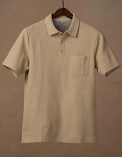 Short Sleeve Waffle Polo in Bleached Sand with 3 button placket and chest pocket, featuring a soft waffled texture.