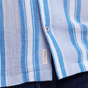 Close-up of short sleeve waffle woven shirt in Pacific Coast colors, featuring a camp collar and button detailing.