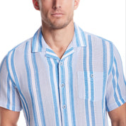 Man wearing a short sleeve waffle woven shirt in Pacific Coast with camp collar and button-down chest pocket.