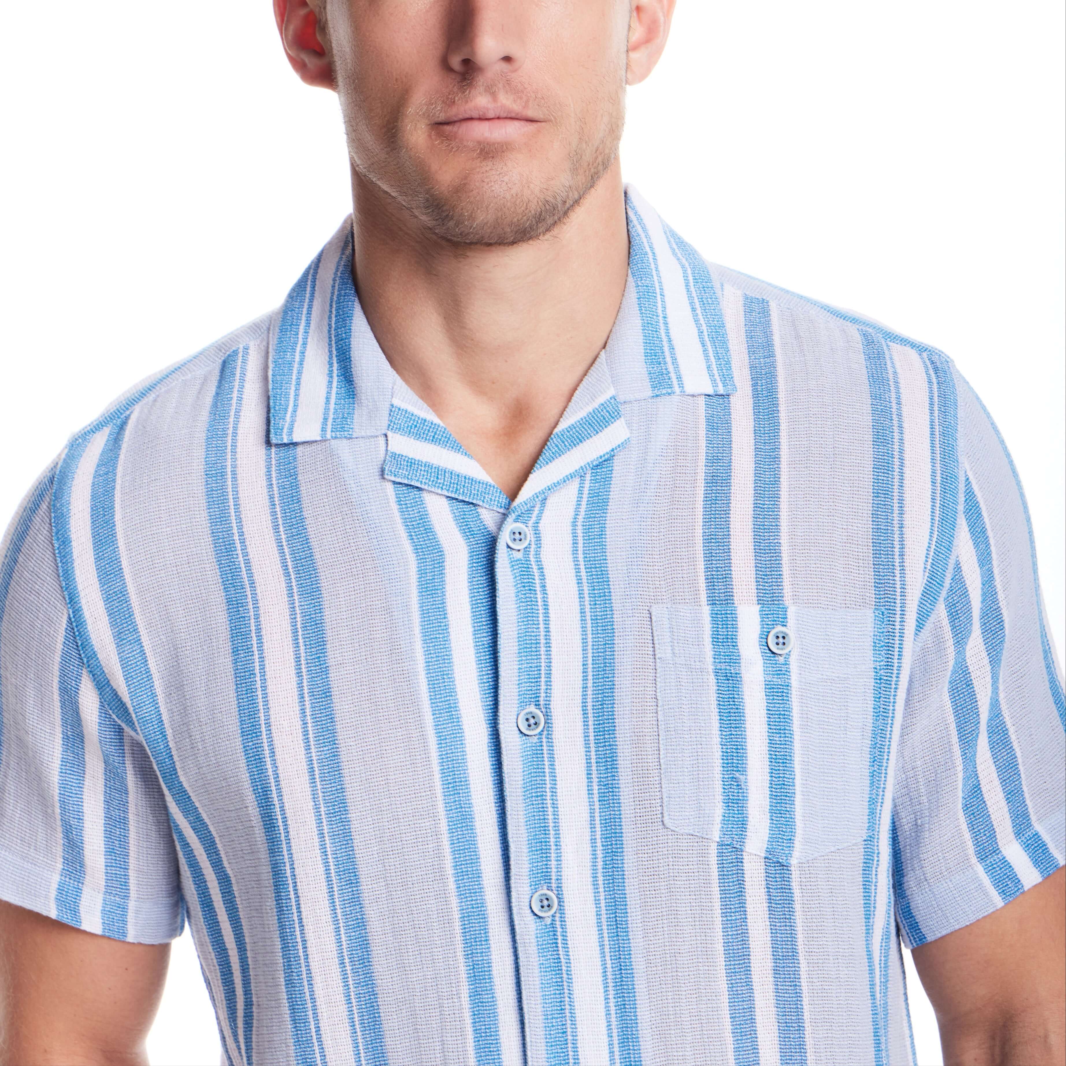 Man wearing a short sleeve waffle woven shirt in Pacific Coast with camp collar and button-down chest pocket.