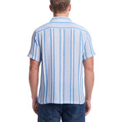Back view of a man in a short sleeve blue striped shirt made from breathable AirTex fabric.