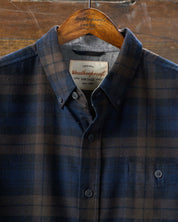 Long sleeve brushed flannel shirt in toffee with plaid pattern, featuring button down collar and chest pocket.