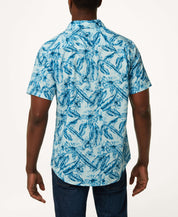 Poplin Floral Print In Sky Blue - Back view of a man wearing a floral poplin button down shirt in soft cotton.
