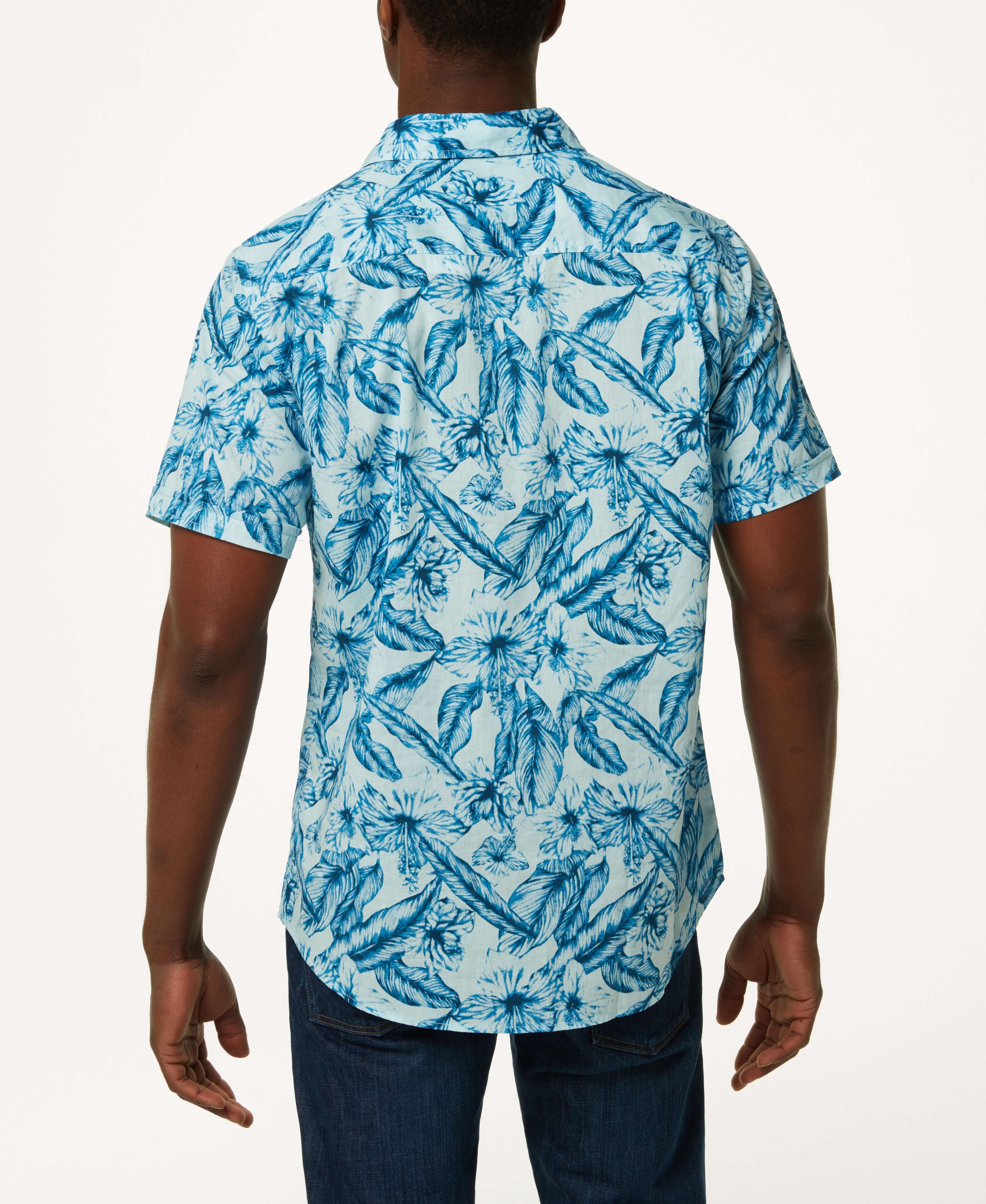 Poplin Floral Print In Sky Blue - Back view of a man wearing a floral poplin button down shirt in soft cotton.
