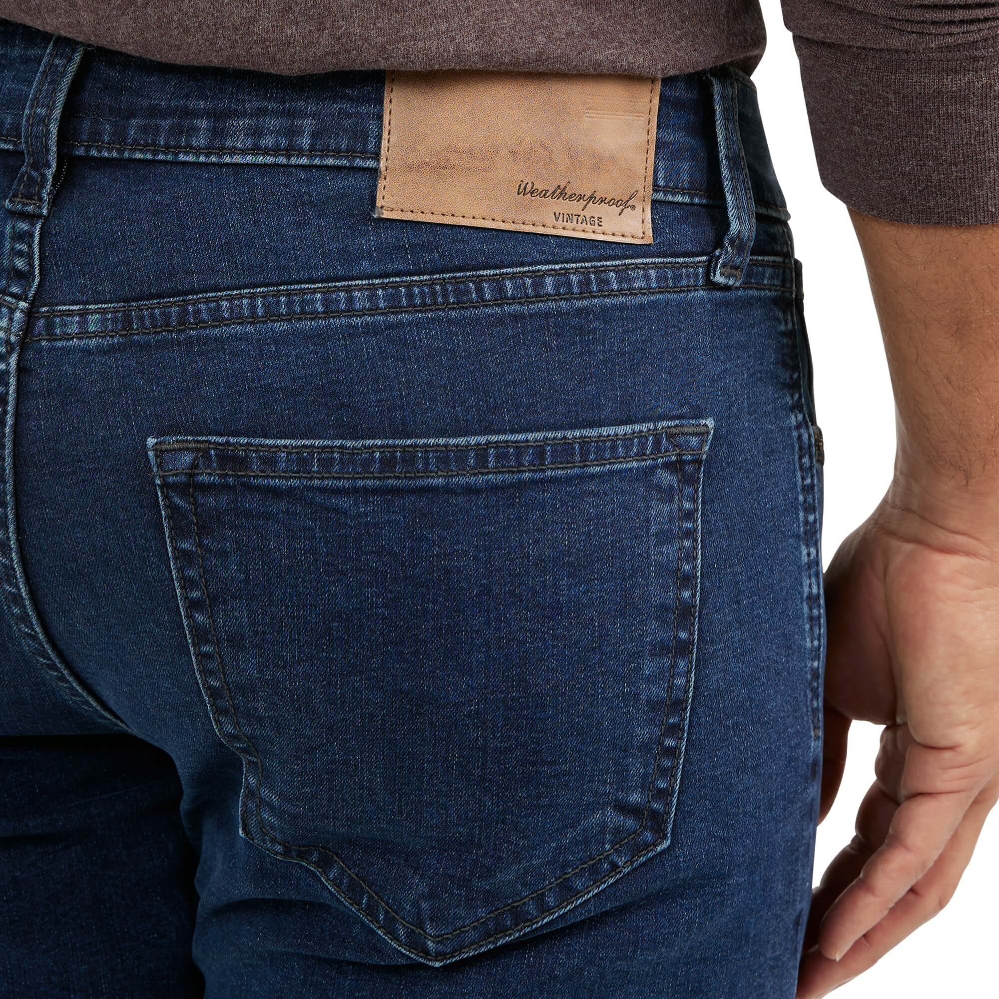Close-up of Slim Fit Denim Jeans in Carolina Blue showcasing back pocket and leather label.