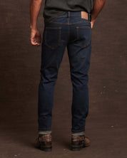 Back view of slim fit denim jeans in moon shadow, showcasing stretch fit and premium cotton design.
