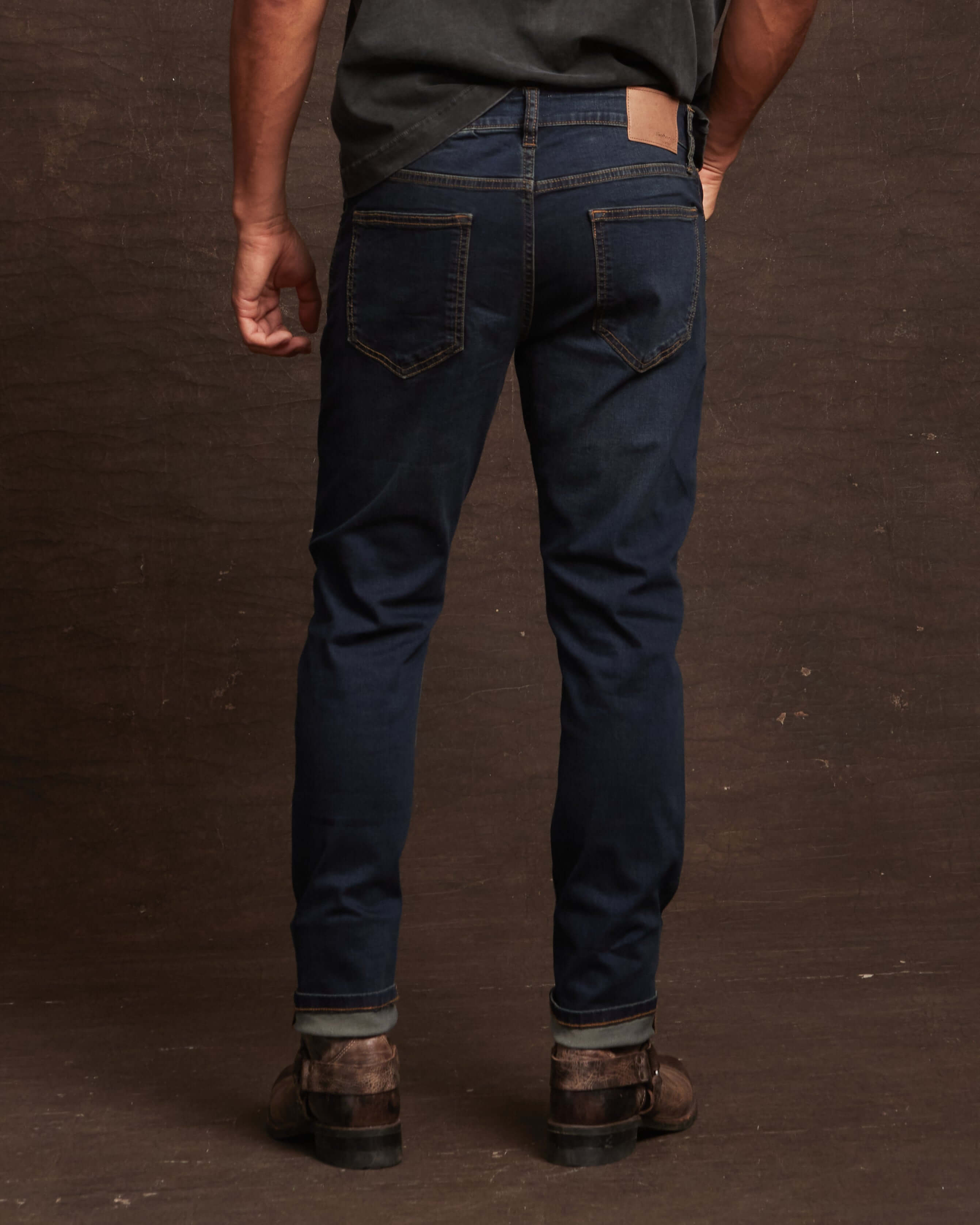 Back view of slim fit denim jeans in moon shadow, showcasing stretch fit and premium cotton design.