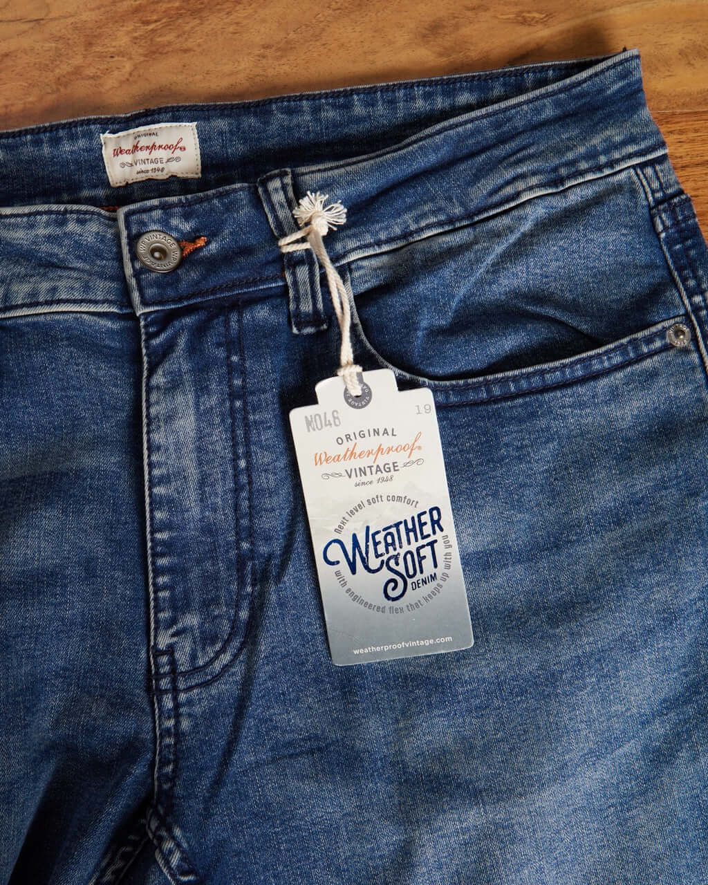 Close-up of slim fit Weather Soft vintage denim jeans with tag, showcasing premium denim craftsmanship.