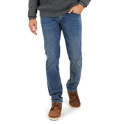 Slim fit denim jeans in Niagara, featuring all-way stretch and a comfortable fit, styled with a grey sweater and brown boots.